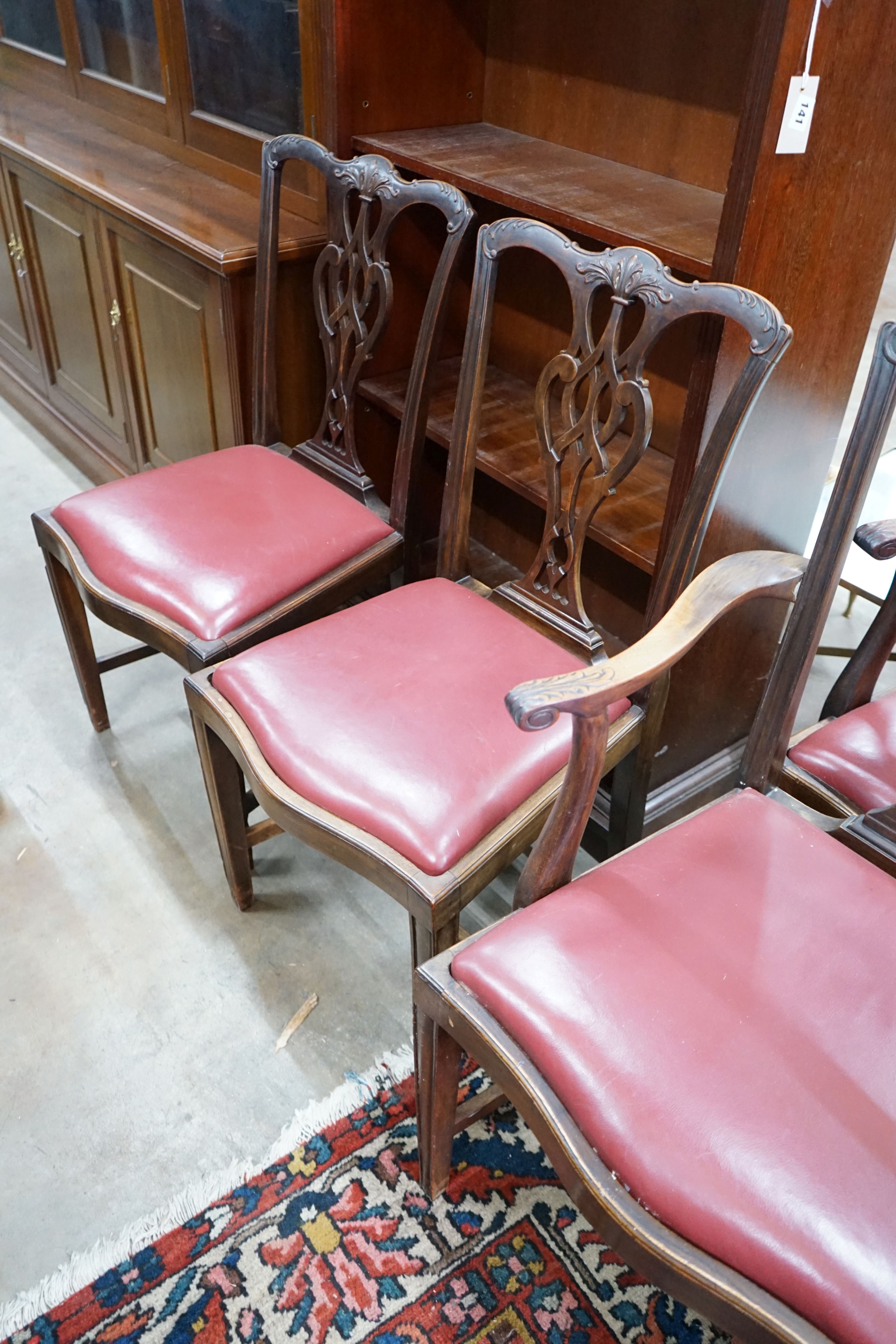 A set of eight Chippendale revival mahogany dining chairs with pierced splats, two with arms